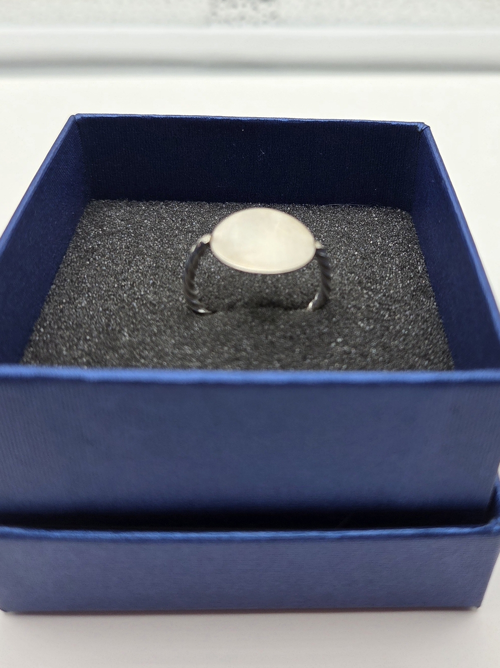 Sterling Silver signet ring with twisted band. Size 10.